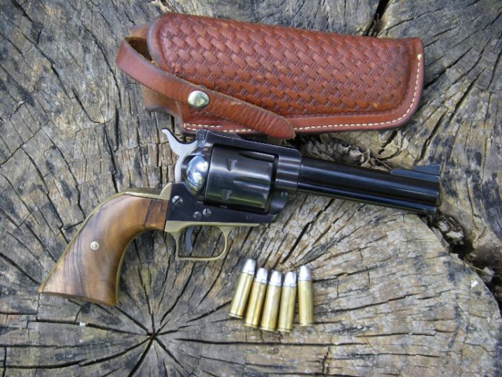 This early Ruger Blackhawk .41 Magnum with serial number 67 was owned by Elmer Keith, who was the driving force in convincing Smith & Wesson, Bill Ruger and Remington to work together and develop this cartridge.  It features a Super Blackhawk style brass grip frame, custom stocks and is shown with an original George Lawrence Keith designed 120 holster. Keith took many large Idaho jackrabbits (a pest) and mule deer with this outfit.  The revolver is capable of top accuracy and often produces ragged, one-hole groups at 25 yards, naturally with Keith bullets.